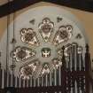 Detail of E rose window with organ in front.