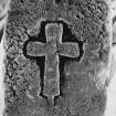 Detail of fragment of medieval graveslab bearing outline Latin cross, possibly of Early Christan date and held in store at Langholm.