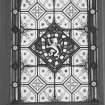 Interior.
First floor, hall, detail of NE stained glass window, E panel.