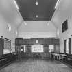 Interior.
View of church hall from W showing gallery.