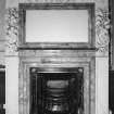 Interior, 1st. floor, room 39, detail of fireplace with decorated mirror above.