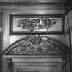 Interior, 1st. floor, drawing-room, detail of carved wooden panel above door to main staircase.