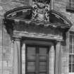 South facade of castle, detail of pediment over main entrance.