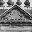 Courtyard, detail of pediment above window