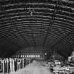 Interior.
General view from SSW, showing internal curved substructure of lattice-steel girders supporting outer shell.