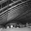 Interior.
General view from SW, showing internal curved sub-structure of lattice-steel girders supporting outer shell.