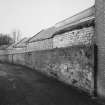 View from E down Pumpfield Lane of former warehouses.