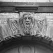 Detail of keystone over doorway on NE elevation.