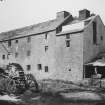 View from S showing mill wheels, sluice gates and part of weir.