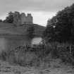 View of Morton Castle from across Morton Loch