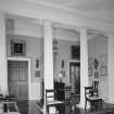 Interior. First floor. Stair landing and column screen.