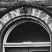 Detail of inscriped architrave above main entrance.