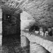 Interior, view of lower ground floor vaulted cellar under entrance court