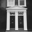 Detail of pedimented double doorway.