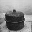 Detail of bean shaped bollard with external bar, formally used as retort in old gasworks.