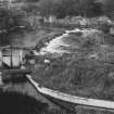 General view of weir and mill lade sluice gate.