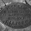 Detail of John Reid's manufacturer's nameplate on millstone.
