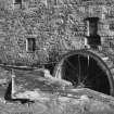 Detail of threshing barn waterwheel and lade.