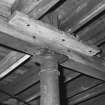 Interior.
Detail of typical cast-iron column head supporting wooden beam and floor.