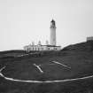 General view from NE of lighthouse compound, with helicopter pad in foreground.