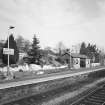 View from SW of N-bound platform, including waiting room and shelter, and station garden