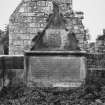 Monument against West wall of burial enclosure to East of East gable of church