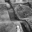 Lyne, Roman fort. Excavation photograph: section across outer ditch on E side.
