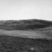 Distant view of road crossing N end of valley, from S.