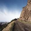 Holyrood Park: Salisbury Crags and Radical Road looking N, with Edinburgh Castle in background
