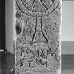 Cross-incised and inscribed slab.