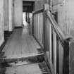 Donibristle airfield, view of top of wooden staircase and corridor within officers' mess.