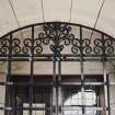 Museum block, entrance porch, detail of ornamental iron-work above gate