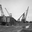 Inverkeithing Bay, Thomas Ward and Sons Shipbreaking Yard, Number 1 and 2 Jetties
Jetties Nos. 1 and 2: view from SW of (left) Thomas Smith and Son of Rodley, Leeds, rail-mounted crane, and (right) 10-ton-lift Butters fixed derrick crane