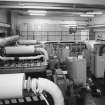 Upper level, entrance, view inside plant room showing emergency generators and switchgear