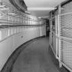 Escape passageway (leading from underground headquarters to exit), view of walls lined with emergency bunks and cable ducts