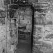 Detail of door in East corner of ground floor East chamber