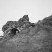 View of kiln from NNW, showing one of three draw arches, and brick vaulted passage beneath ramp (right)