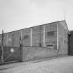 General view of South West corner of works, showing brick-clad erecting shop, with cast-iron uprights