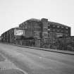 General view of surviving buildings in works from WNW