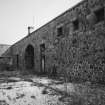 View from South in court behind carriage house and stable block.  
Photosurvey 10 February 1994 at Kilrie Farm