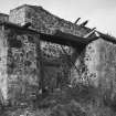 View from South East showing remains of cast-iron lade leading to water-wheel house (to right). 
Photosurvey 10 February 1994 at Kilrie Farm