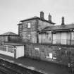 View of down platform with shelter and main station buildings from NE.