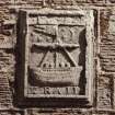 North west facade, detail of Burgh Arms heraldic '160-' datestone