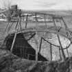 Detailed view from E of mouth of pot of old lime kiln, with lime works visible in background