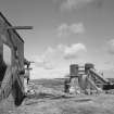 Distant view from S of two shaft kilns, with E side of winding-engine house (left)