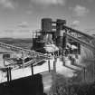 View from SW of two shaft kilns, now no longer functioning, and used instead to store crushed limestone