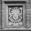 Detail of armorial panel above W entrance