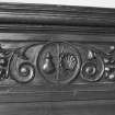 Detail of panelling with pilgrim's staff and shell