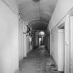 Interior, view of vaulted basement corridor