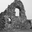 West gable wall showing excavated foundations of side walls